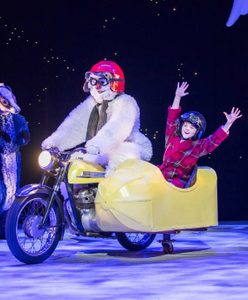 The Snowman and the boy riding in their motorcycle and sidecar