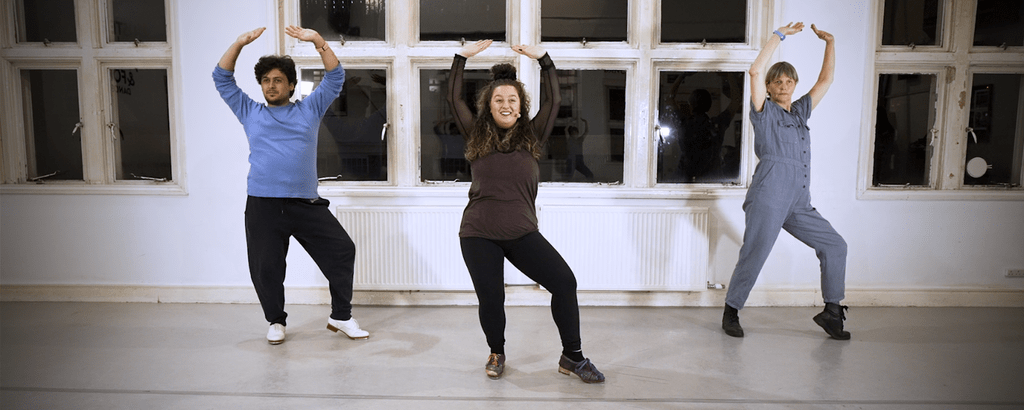Tap dancers doing a workshop in a dance studio